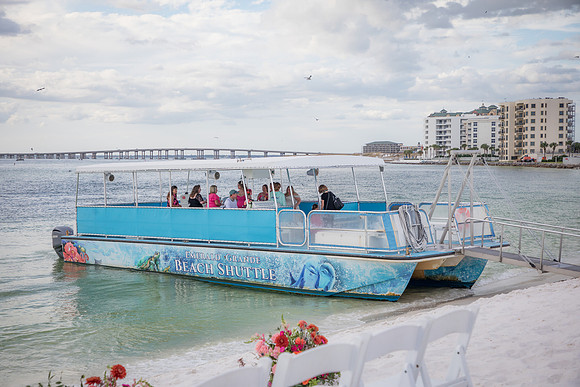 A photo of the beach shuttle - a boat - to get wedding guests to the Destin jetties for a wedding.