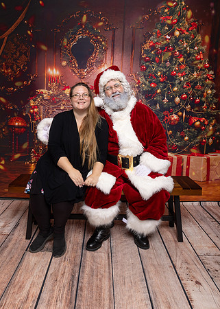 Santa Eddie with a Christmas backdrop for photos